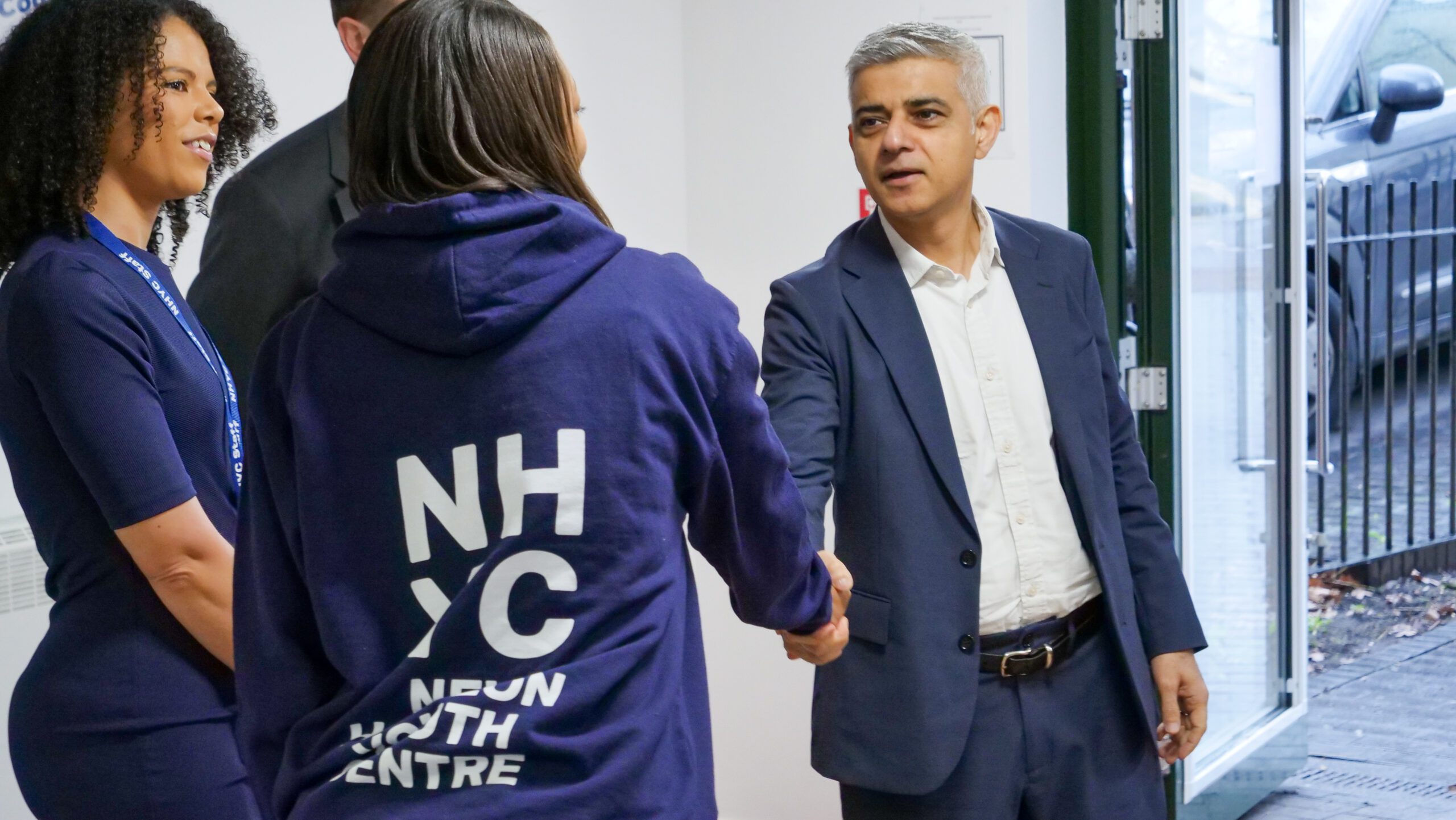 A photograph of the Mayor of London, Sadiq Khan, shaking hands with a New Horizon staff member